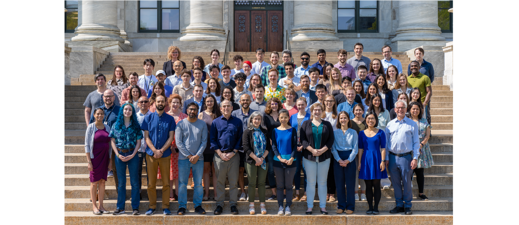 Group portrait of LSP lab members standing outside Gordon Hall